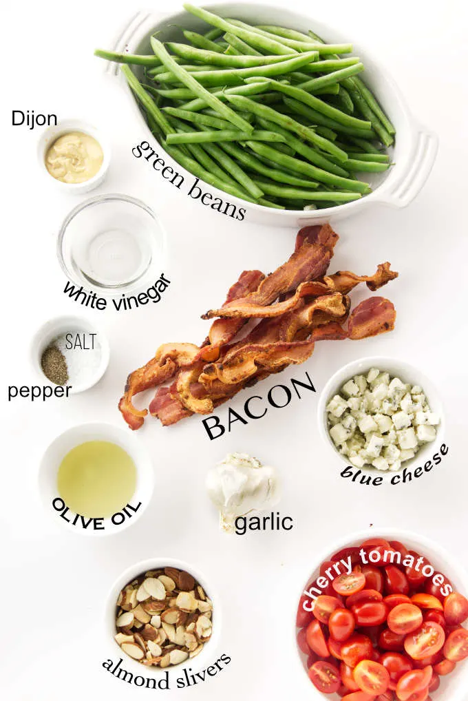 Ingredients used for making a green bean salad with bacon.