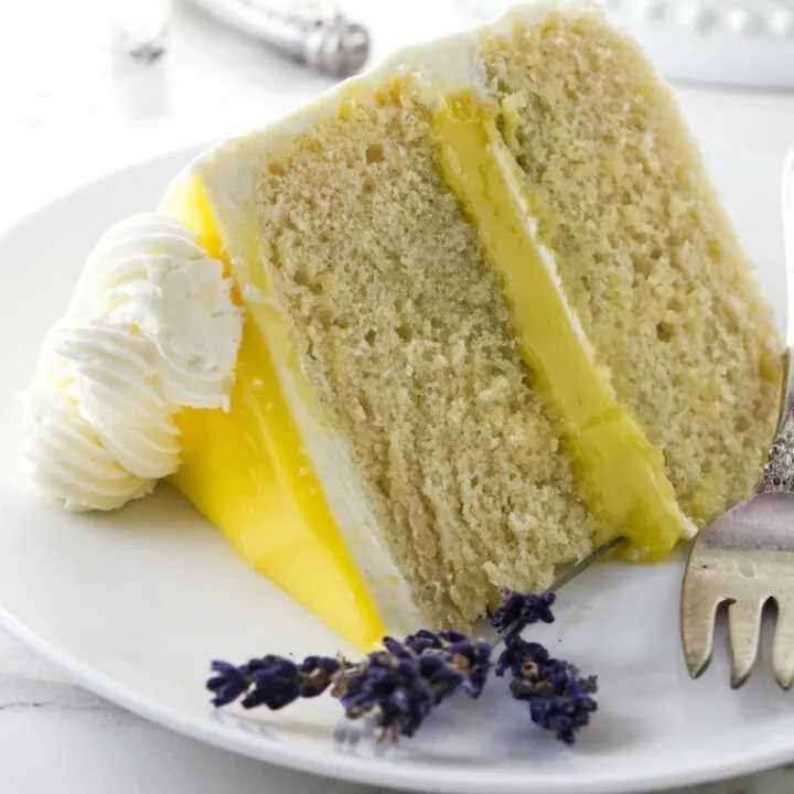 A slice of lemon lavender layer cake. with lemon curd.