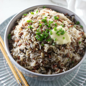 A bowl of royal blend rice with a pat of butter on top.