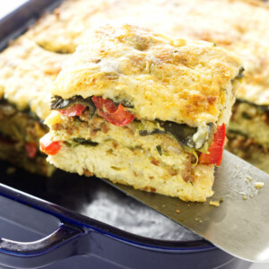 Serving of Poblano Chorizo Strata being lifted from dish