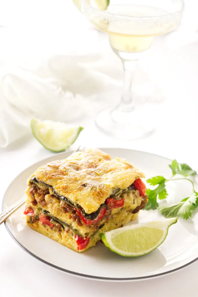 A serving of Poblano-Chorizo Strata, Margarita in the background