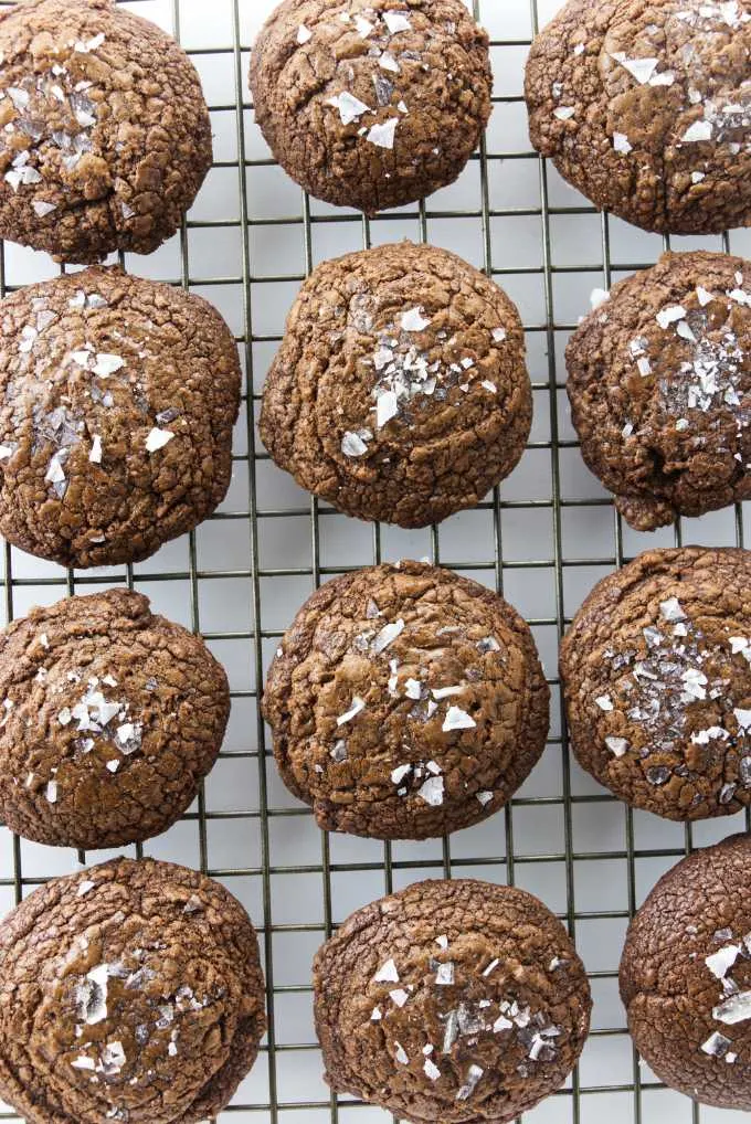 Chocolate fudge cookies cooling on a cookie rack.