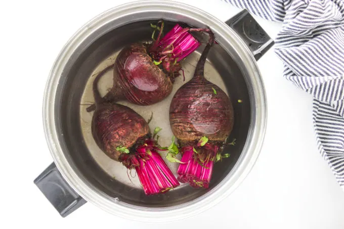 Fresh beets getting ready to be boiled before they get sauteed.