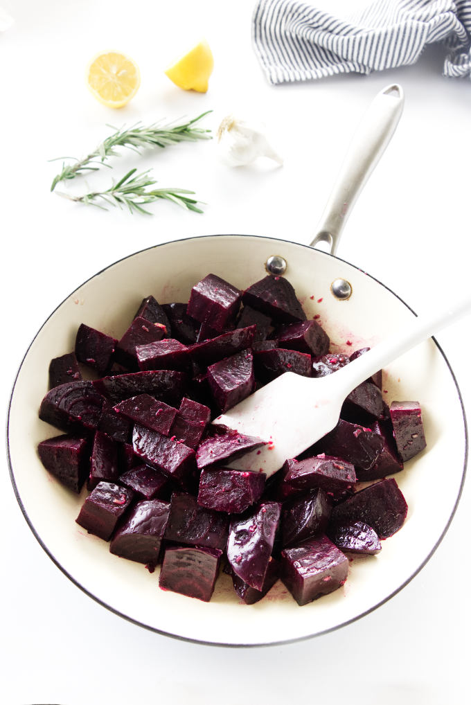 Sliced beets in a pan to make sauteed beets.