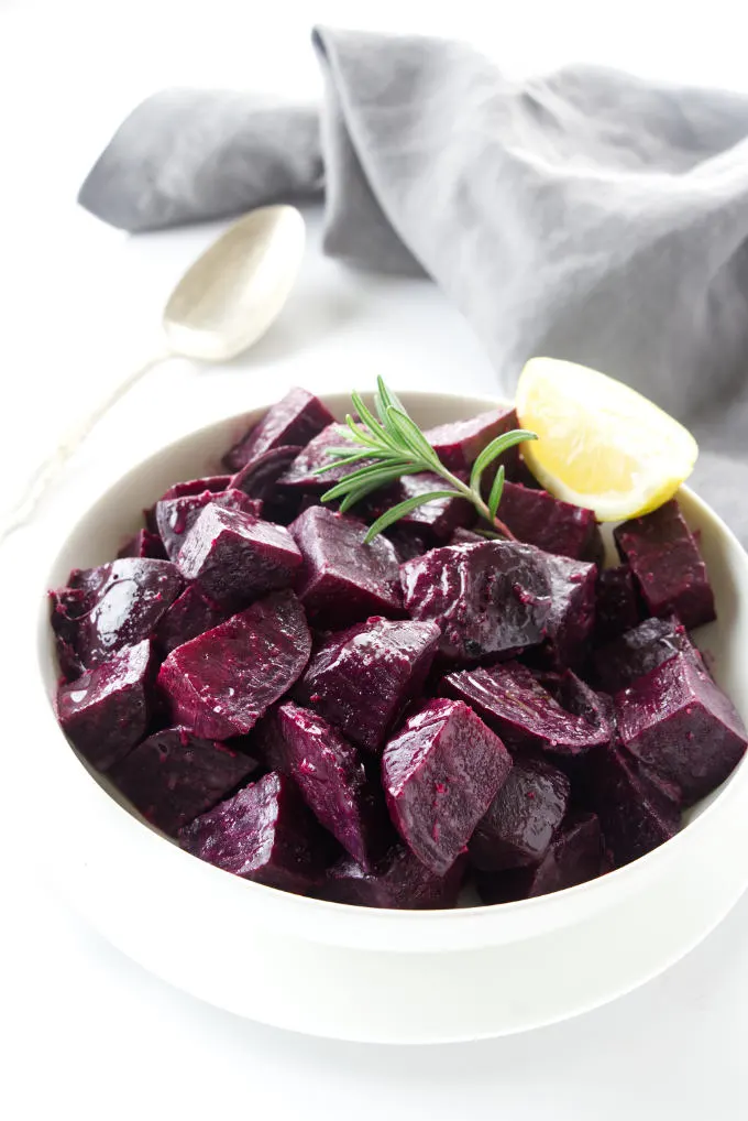 A serving dish of sauteed beets.