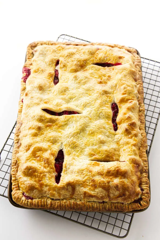 Strawberry-Rhubarb Slab Pie on a cooling rack