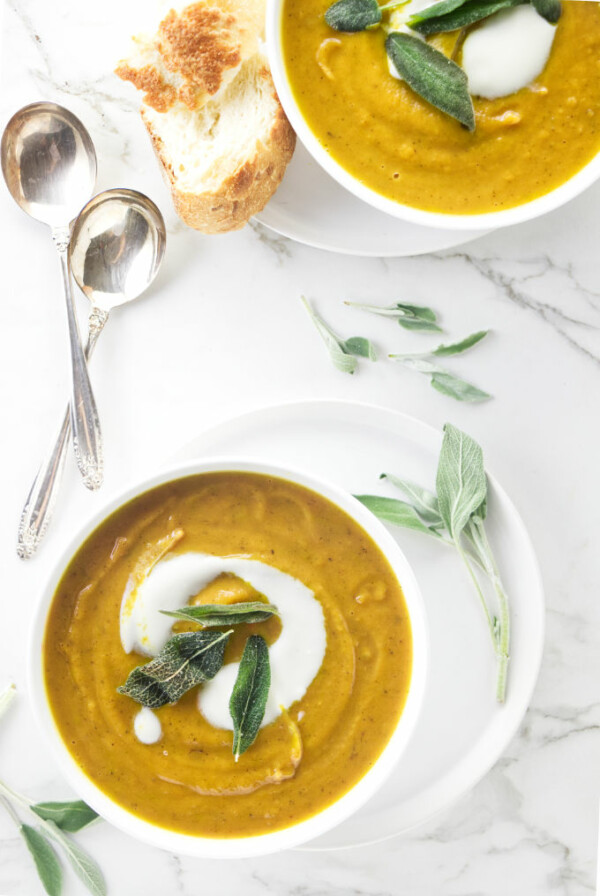 Two bowls of sweet potato sage soup.