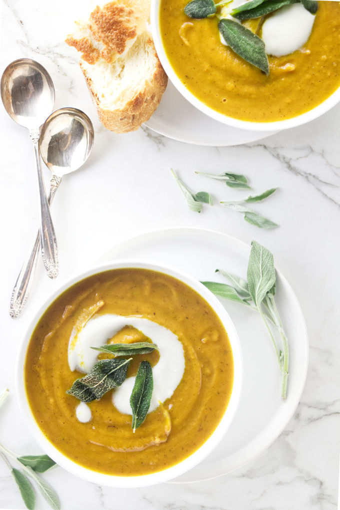 Two bowls of sweet potato sage soup.