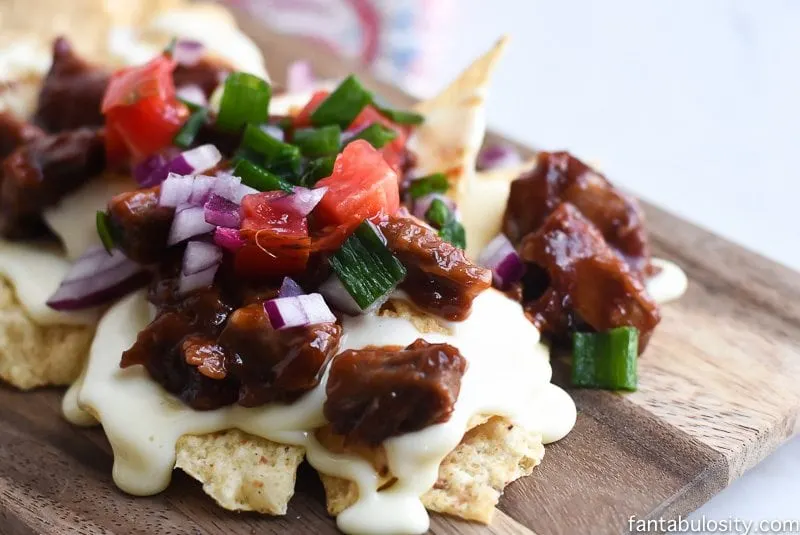 A plate of bbq nachos.