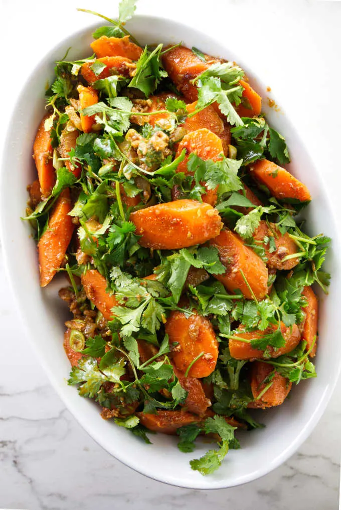 Spicy Moroccan carrot salad in an oval serving dish.
