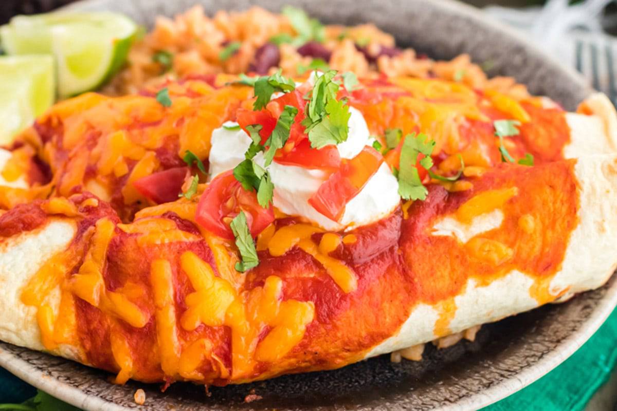 A dinner plate filled with steak enchiladas.