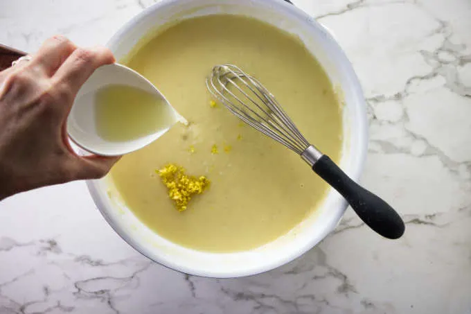 Adding lemon juice and lemon zest to lemon garlic butter sauce.