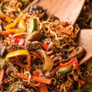 A skillet filled with beef ramen stir fry.