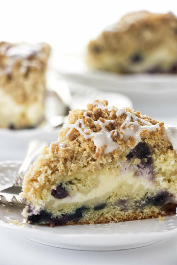 A slice of blueberry coffee cake cheesecake.