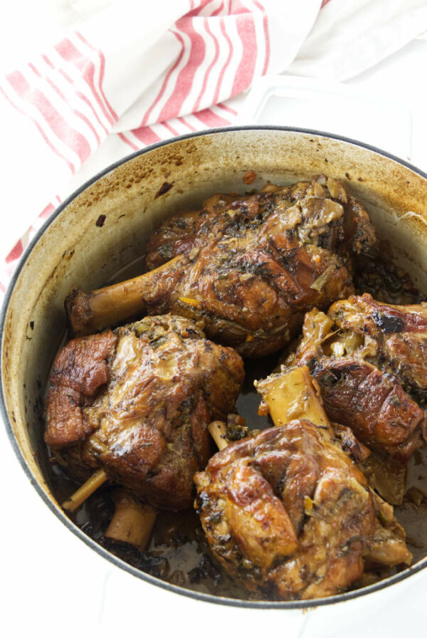 Dutch oven with 4 braised pork shanks