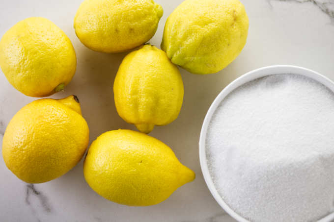 Ingredients needed to make candied lemon slices.