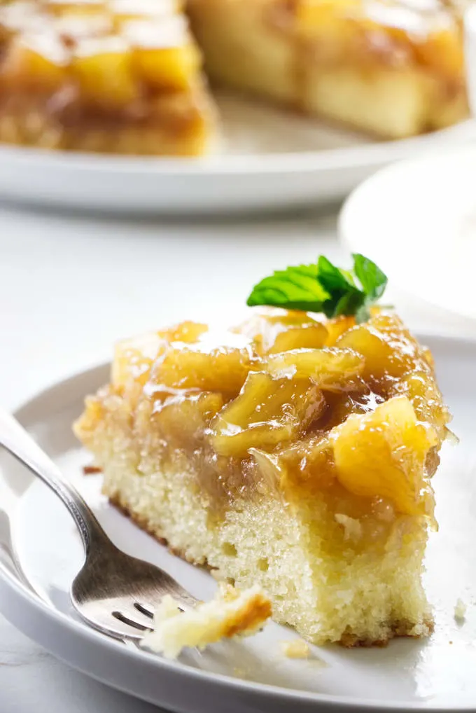 A slice of pineapple cake with a fork.