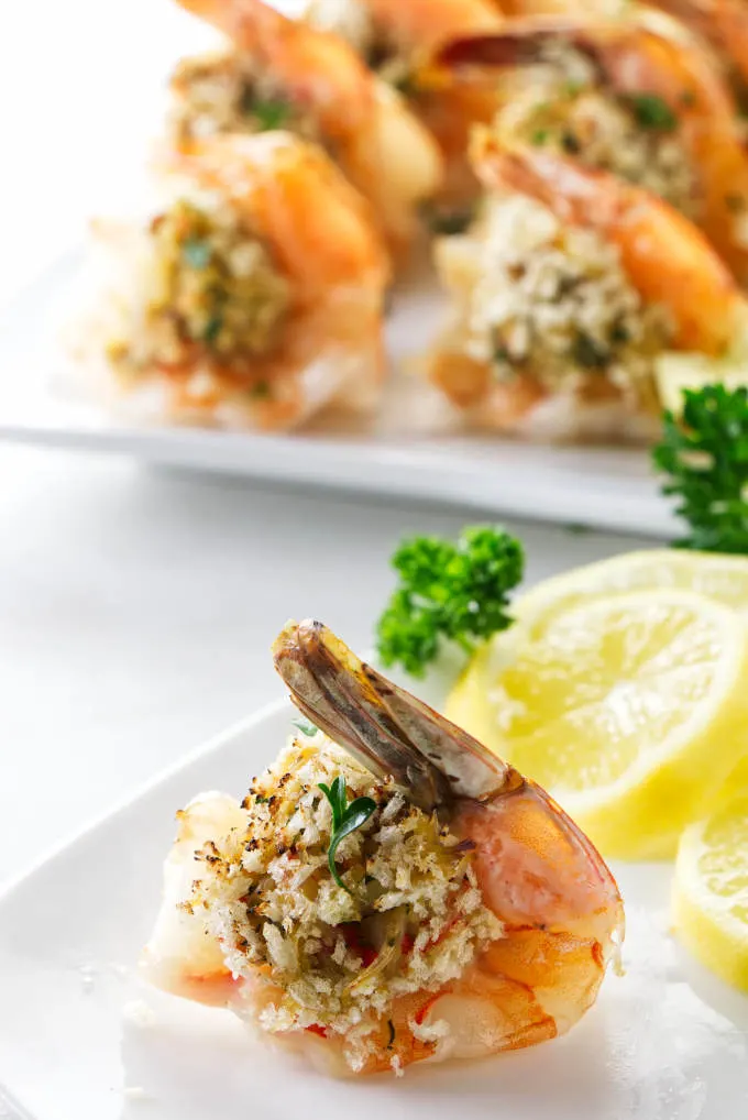 A stuffed shrimp on an appetizer plate.