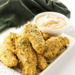 Crispy Oven Baked Chicken Tenders appetizers with a chipotle aioli dip