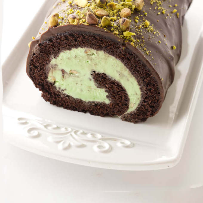 Close up view of chocolate and pistachio ice cream cake roll