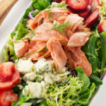 Overhead view of a bowl of Salmon Salad with Strawberries