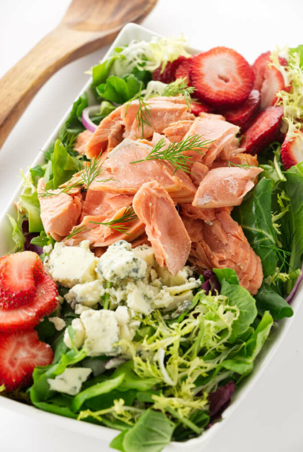 Overhead view of a bowl of Salmon Salad with Strawberries