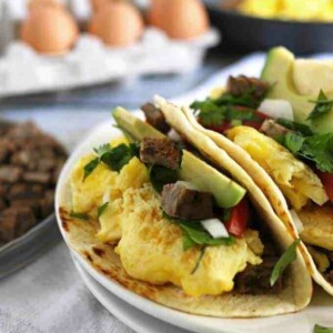 Taco shells filled with steak and eggs.