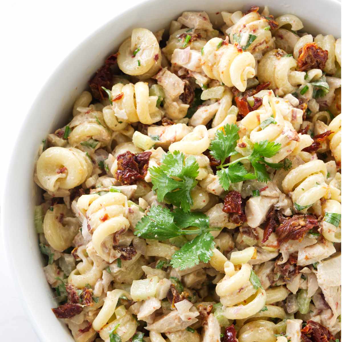 A dish filled with chicken chipotle pasta salad.