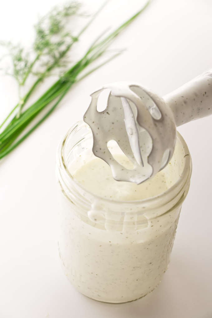 A jar of homemade buttermilk ranch dressing with imersion blender