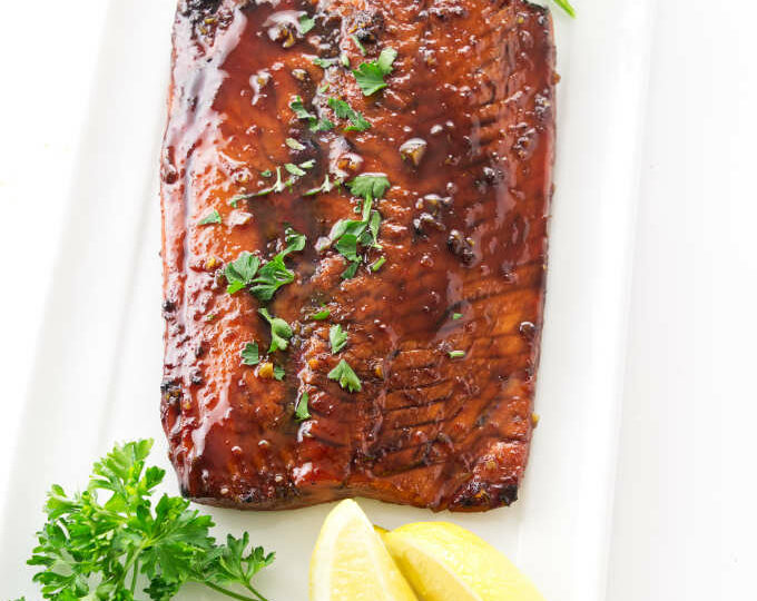 Bourbon glazed salmon on a serving platter.