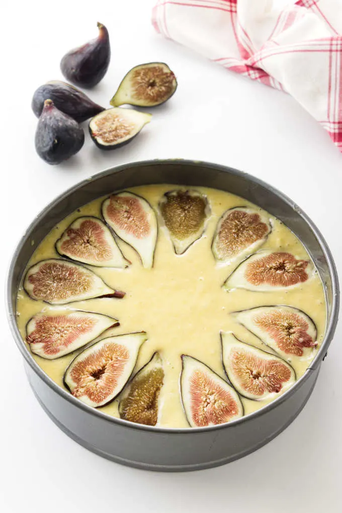 Overhead view of figs on cake batter