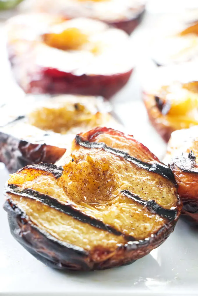 A platter of warm grilled peaches.