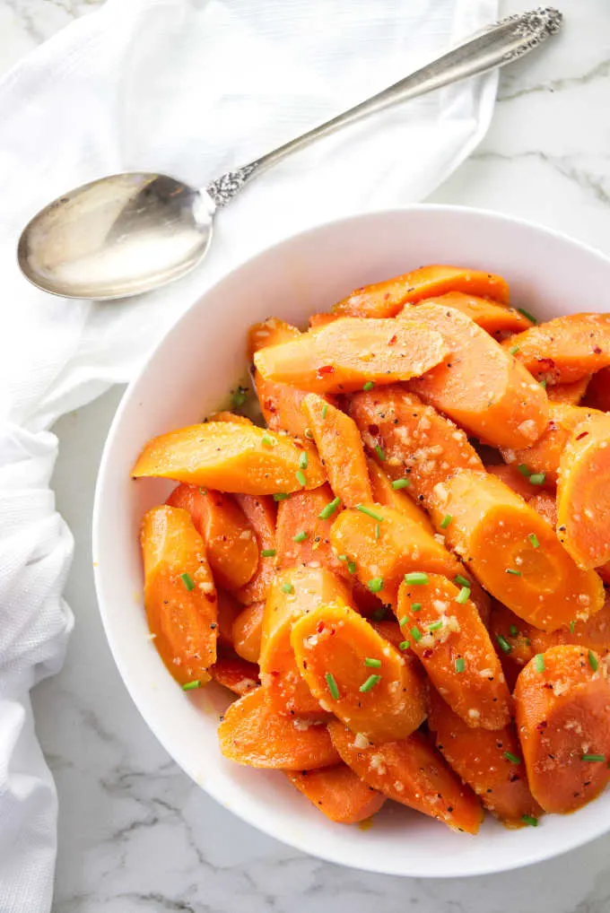 A bowl of honey glazed carrots.