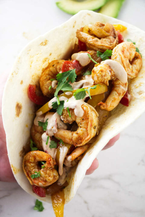 A shrimp fajita in a flour tortilla.