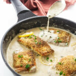 Creamy lemon-caper sauce with salmon fillets