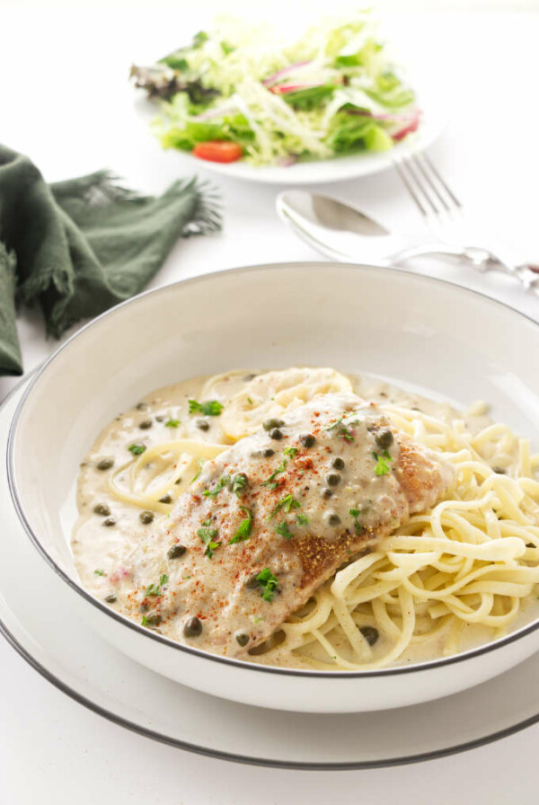 Lemon Salmon Piccata on a mound of linguini pasta