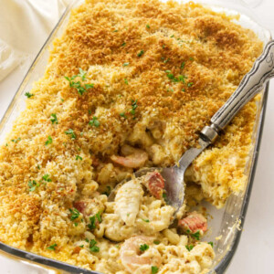 A 13 x 9 baking dish with baked seafood mac and cheese.