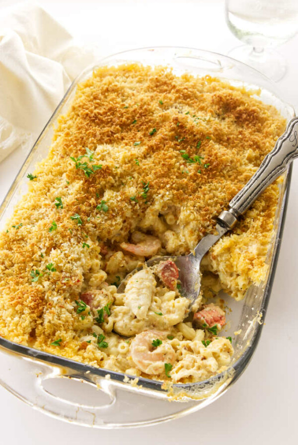 A 13 x 9 baking dish with baked seafood mac and cheese.