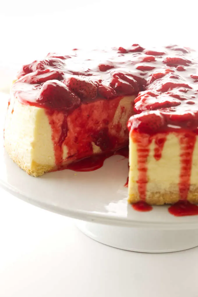 A cheesecake with strawberry topping.