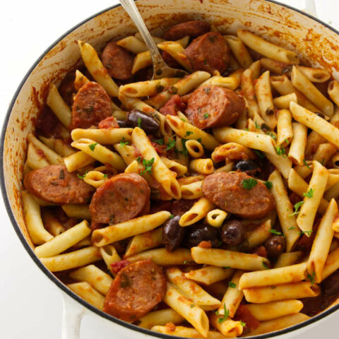 Overhead view of penne arrabiata with smoked sausage