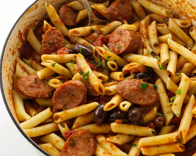 Overhead view of penne arrabiata with smoked sausage