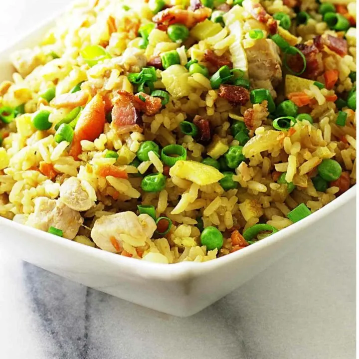 A dish of pork fried rice with leftover pork chops.