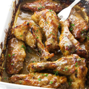 Baked turkey wings in a baking dish.