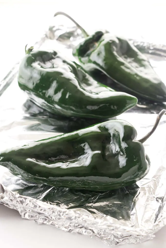 Poblano peppers on a sheet pan.