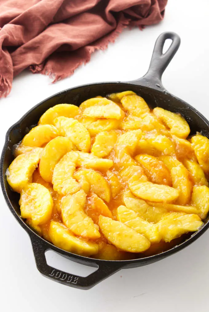 Sliced peaches in a skillet