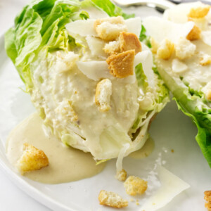 Close up view of Little Gem Caesar Salad on a plate with a fork