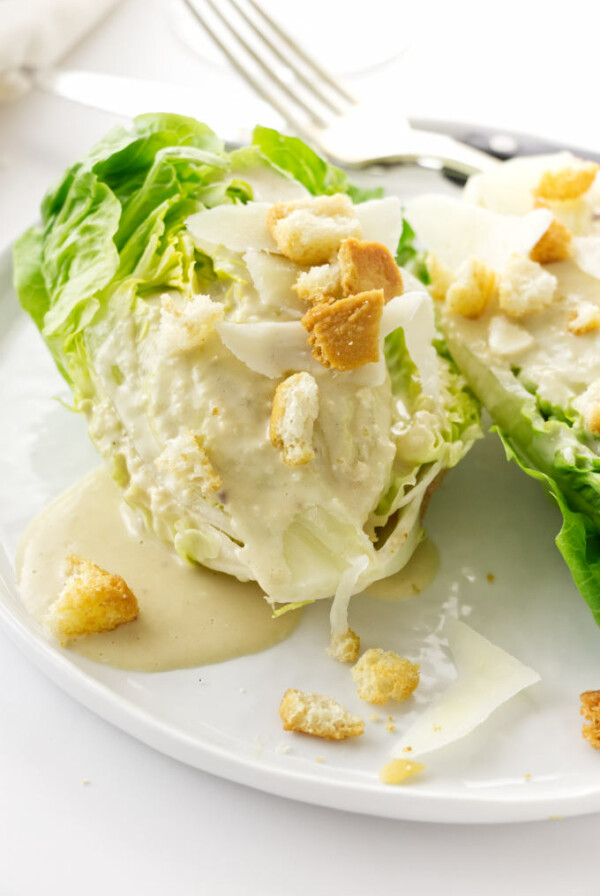 Close up view of Little Gem Caesar Salad on a plate with a fork