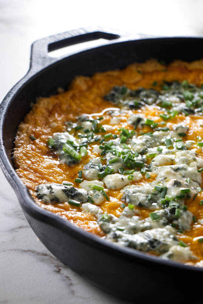 Buffalo chicken dip with blue cheese on top.