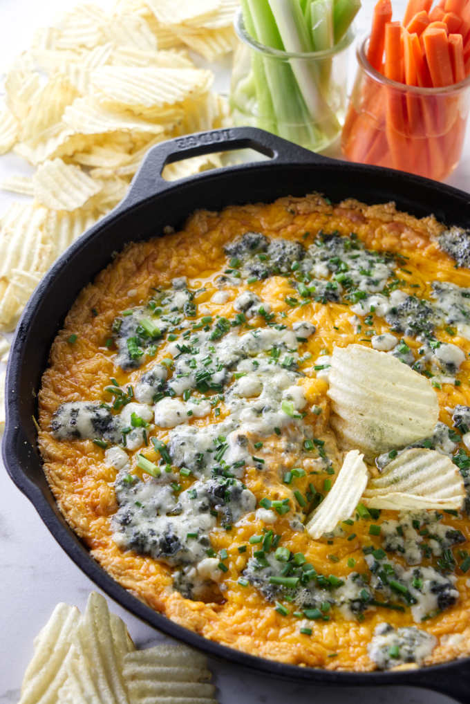 Buffalo chicken dip in a cast iron skillet.