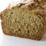 A sliced loaf of gluten free zucchini bread.